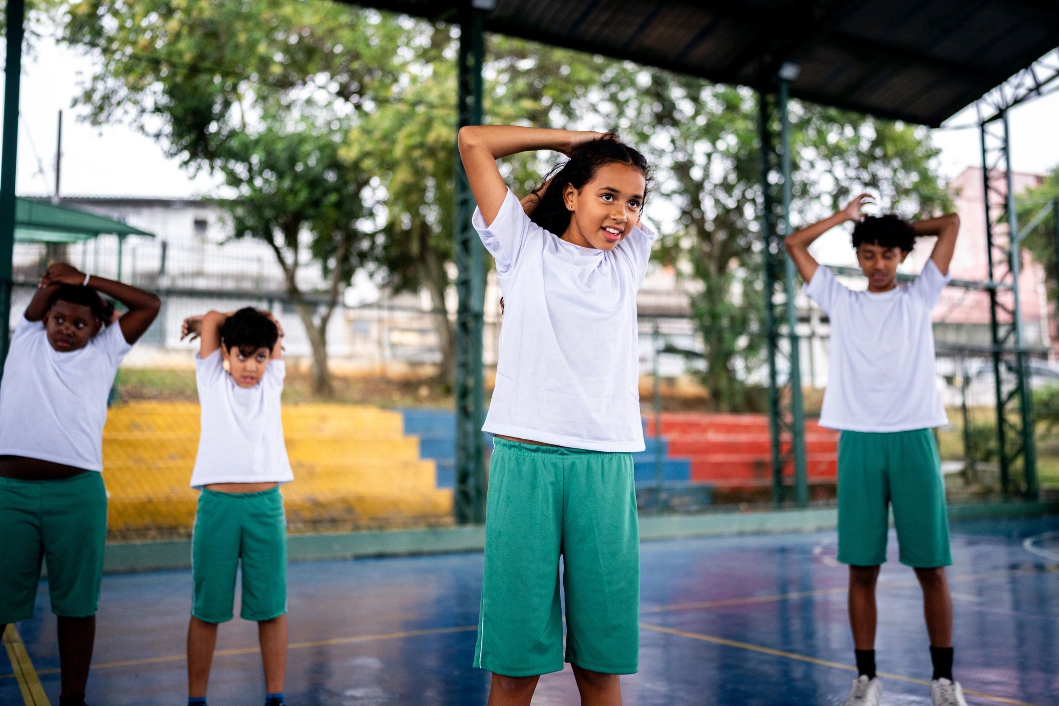 Students warming up together during school athletics activities